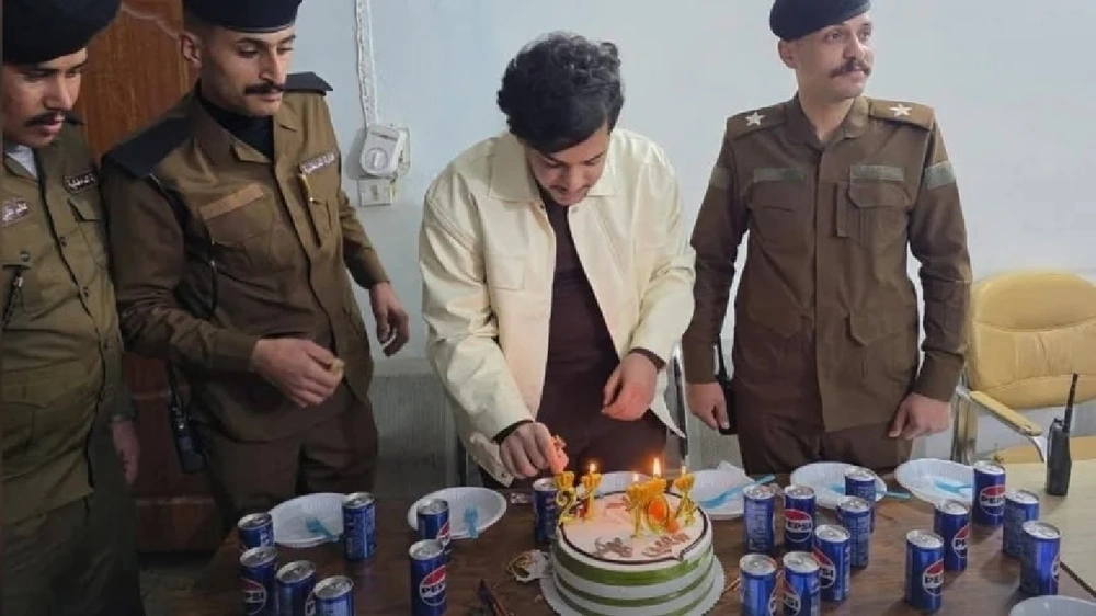 شاب عراقي, عيد الميلاد, الشرطة, النجف, لحظة طريفة, عيد الشرطة